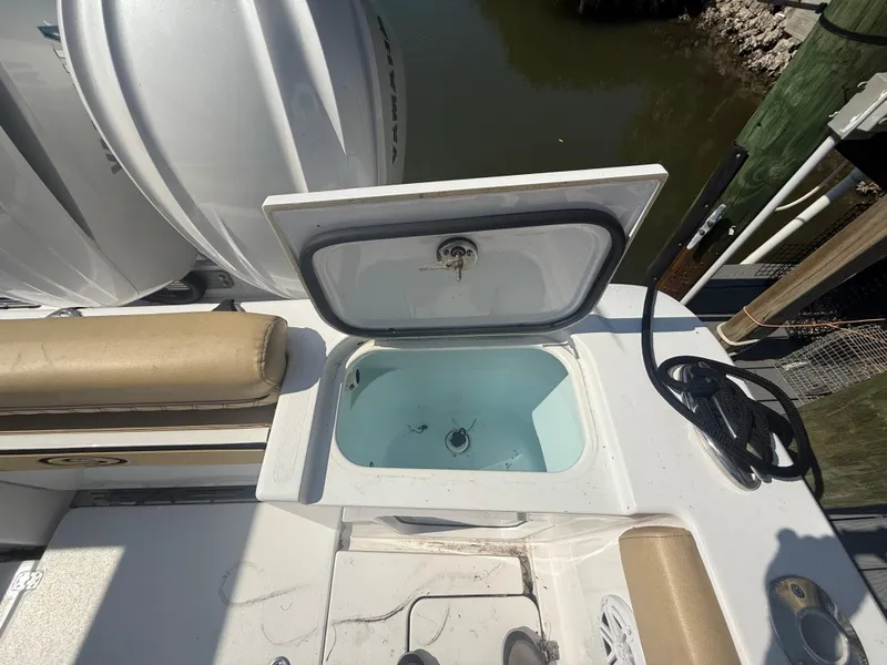 Slide: The Image of 2023 Sportsman Open 282 Center Console boat with open storage compartment. - 14