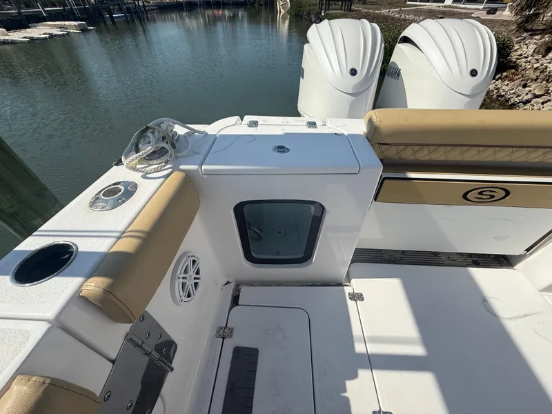 Slide: The Image of 2023 Sportsman Open 282 Center Console boat interior with twin engines. - 13