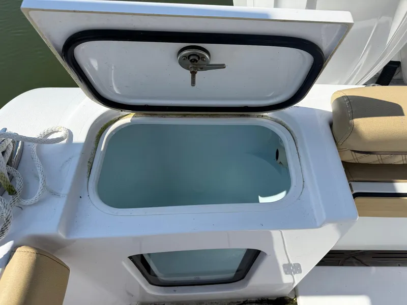 Slide: The Image of 2023 Sportsman Open 282 Center Console livewell with open lid. - 15