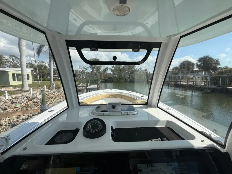 Slide: The Image of 2023 Sportsman Open 282 Center Console boat interior with dashboard view. - 35