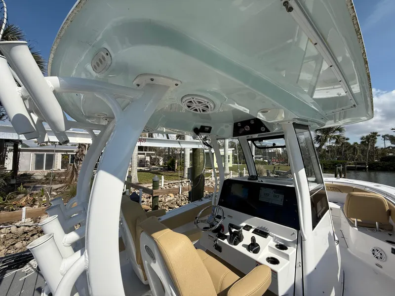 Slide: The Image of 2023 Sportsman Open 282 Center Console boat interior with helm and seating. - 40