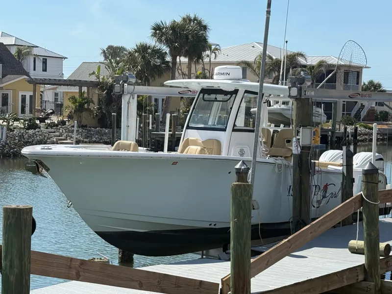 Slide: The Image of 2023 Sportsman Open 282 Center Console boat docked at marina. - 3