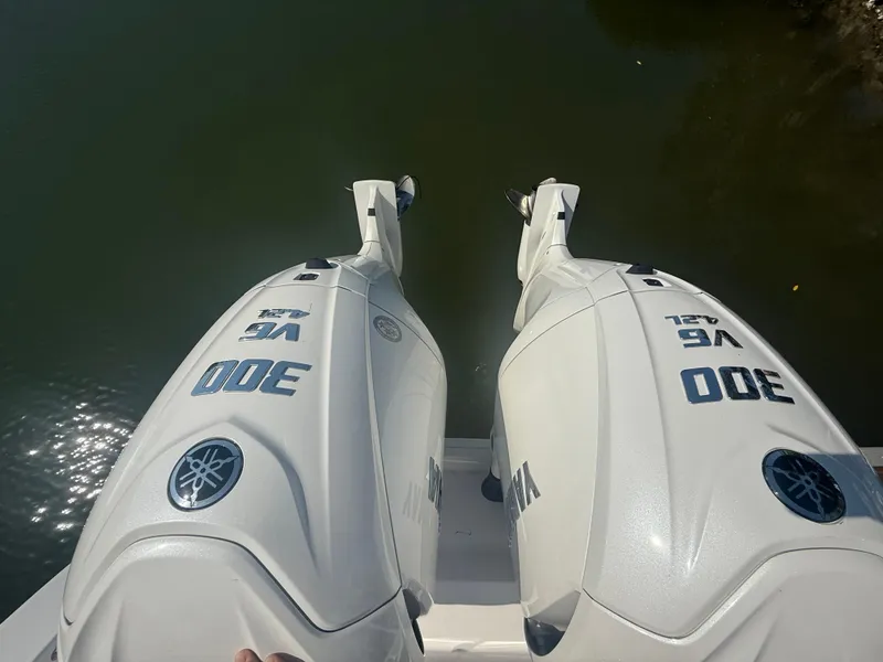 Slide: The Image of Twin Yamaha 300 V6 outboard engines on a 2023 Sportsman Open 282 Center Console boat. - 23