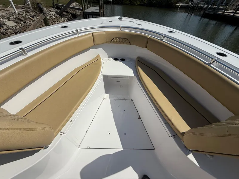 Slide: The Image of 2023 Sportsman Open 282 Center Console boat with tan seating and spacious deck. - 48
