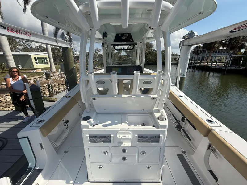 Slide: The Image of 2023 Sportsman Open 282 Center Console boat interior with fishing rod holders. - 21
