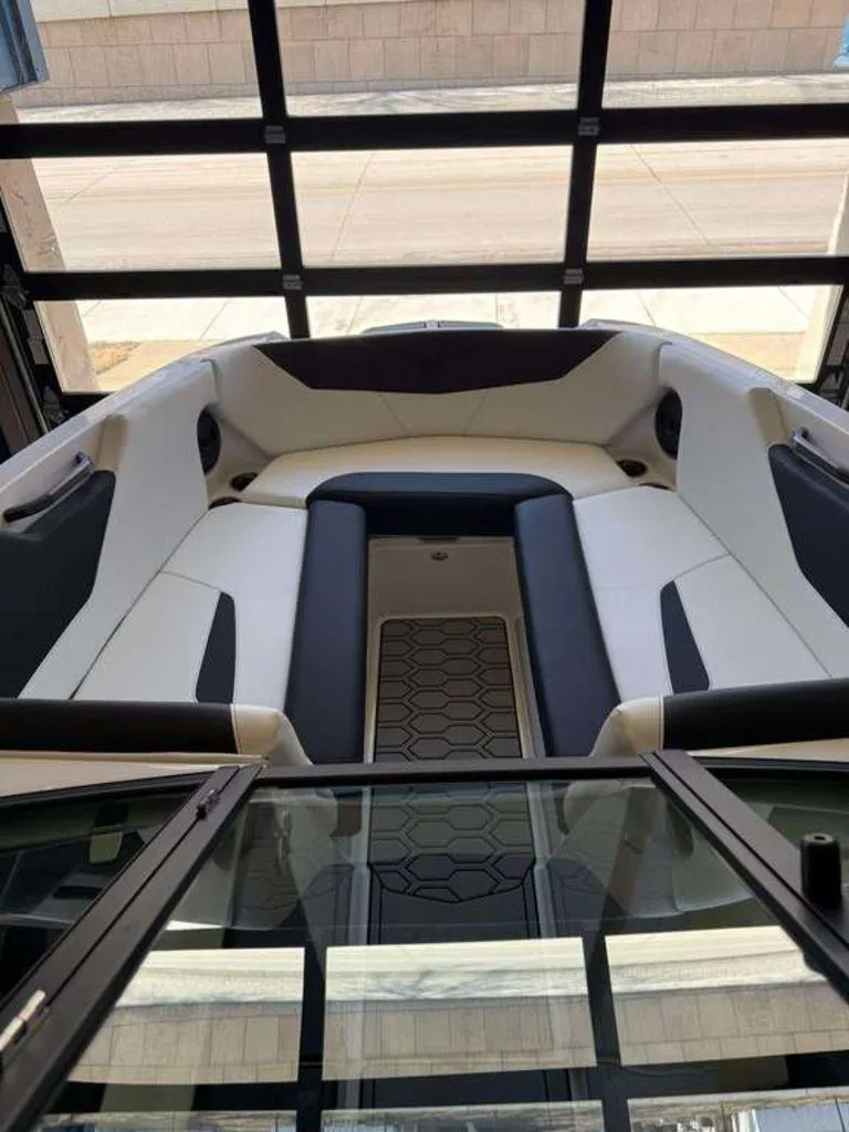 Slide: The Image of 2025 MasterCraft NXT24 boat interior with sleek seating and modern design. - 2
