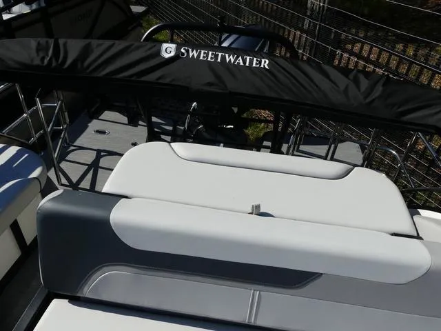 Slide: The Image of 2025 Godfrey Pontoons Sweetwater 2286 SFL boat interior with seating and Sweetwater branding. - 15