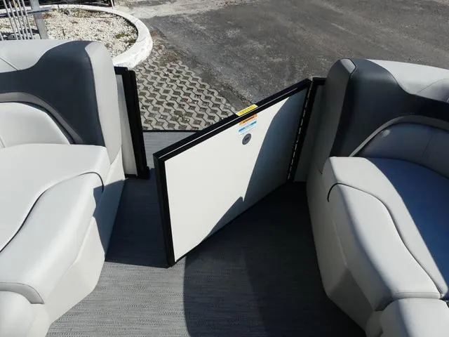 Slide: The Image of 2025 Godfrey Pontoons Sweetwater 2286 SFL interior with open gate and gray seating. - 19