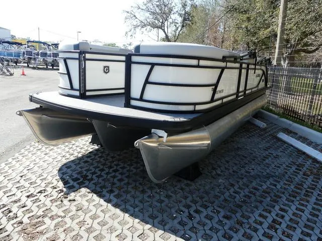 Slide: The Image of 2025 Godfrey Pontoons Sweetwater 2286 SFL pontoon boat parked on a paved surface. - 3