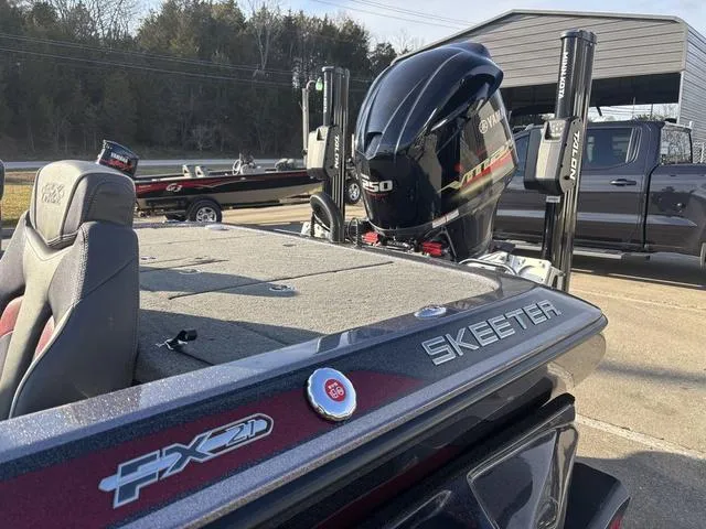 Slide: The Image of 2018 Skeeter FX21 LE boat with Yamaha 250 engine, parked outdoors. - 14