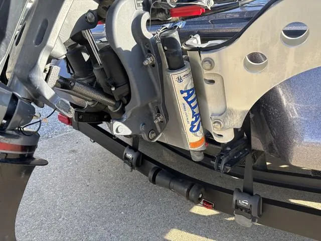 Slide: The Image of 2018 Skeeter FX21 LE boat trailer suspension and shock absorber detail. - 3