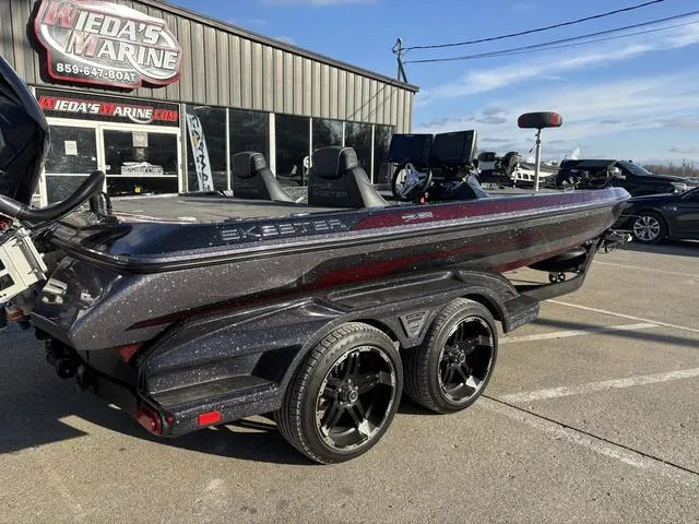 Slide: The Image of 2018 Skeeter FX21 LE boat on trailer at dealership, showcasing sleek design and modern features. - 5