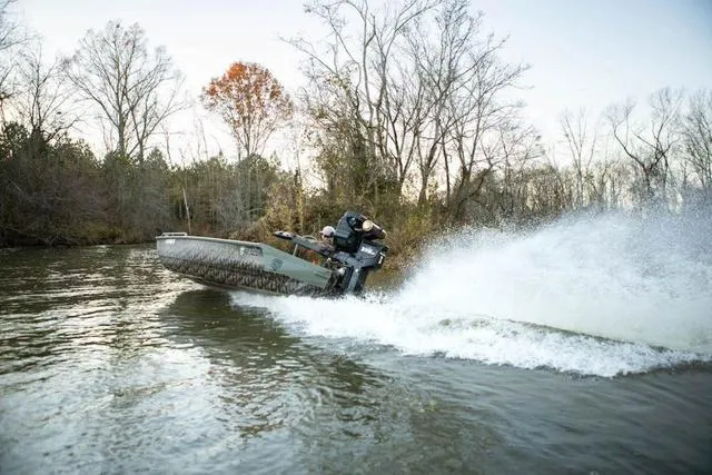 Slide: The Image of 2025 Edge Duck Boats HPSD 756DB speeding on a river, creating a large water splash. - 14