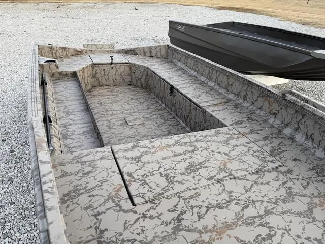 Slide: The Image of 2025 Edge Duck Boats HPSD 756DB with camouflage interior on gravel surface. - 8