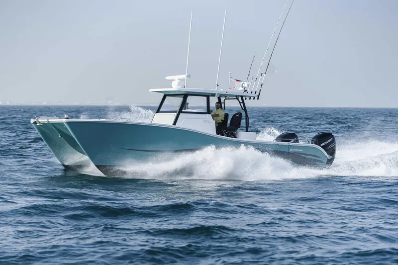 Slide: The Image of 2026 SilverCAT 34CC boat cruising on open water, showcasing sleek design and powerful engines. - 3