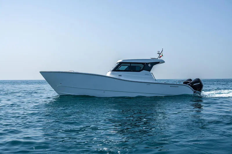 Slide: The Image of 2026 SilverCAT 34HT boat cruising on open water. - 6