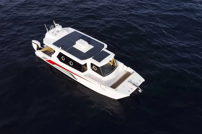 Slide: The Image of SilverCAT 34LUX 2026 boat on open water, aerial view, sleek design. - 4