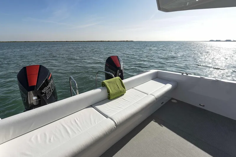 Slide: The Image of Luxury SilverCAT 34LUX boat deck with twin engines, 2026 model, on calm water. - 5