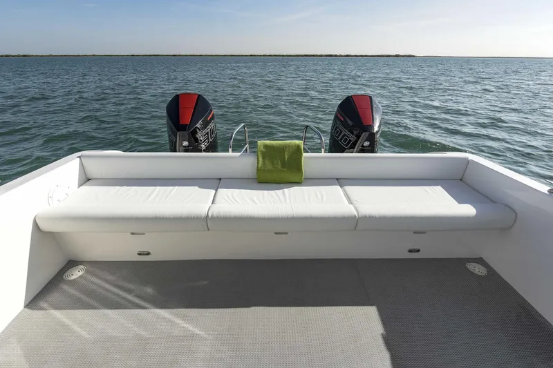 Slide: The Image of SilverCAT 34LUX 2026 boat with twin engines and spacious seating on open water. - 6