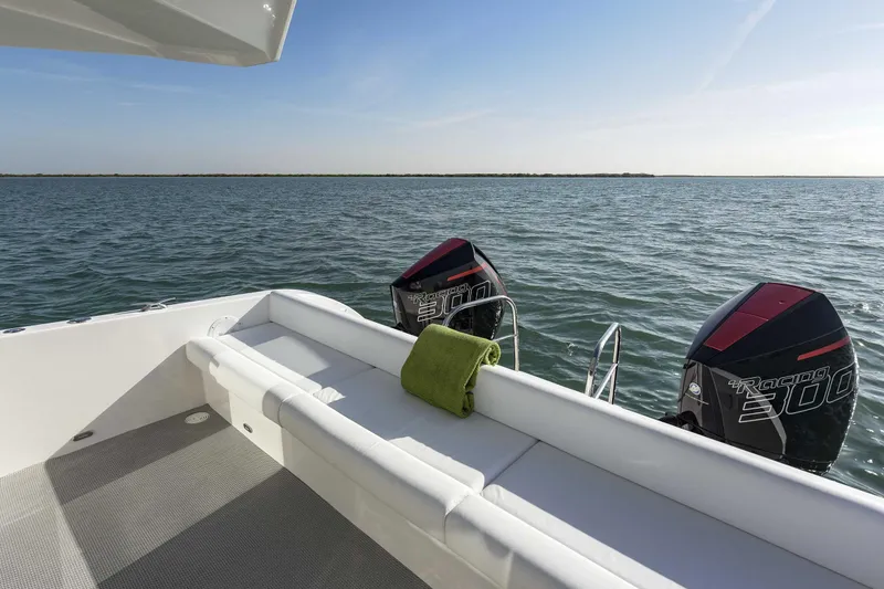 Slide: The Image of SilverCAT 34LUX 2026 boat with twin outboard motors on open water. - 7