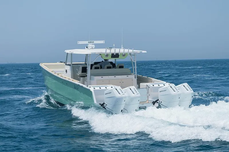 Slide: The Image of SilverCAT 40CC ULTRA 2026 boat cruising on open sea with powerful engines. - 2