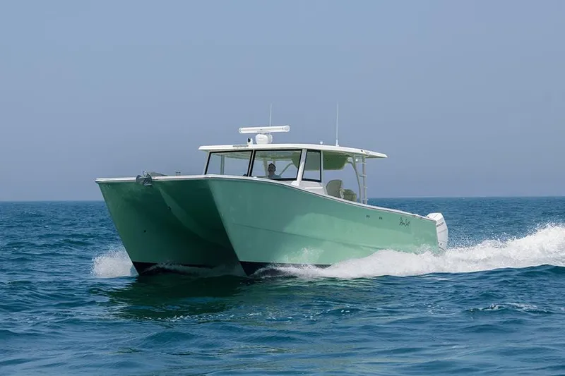 Slide: The Image of SilverCAT 40CC ULTRA 2026 catamaran cruising on open sea, showcasing sleek design and performance. - 6