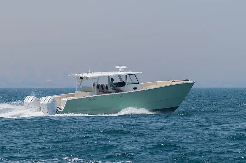 Slide: The Image of 2026 SilverCAT 40CC ULTRA boat cruising on open water. - 7