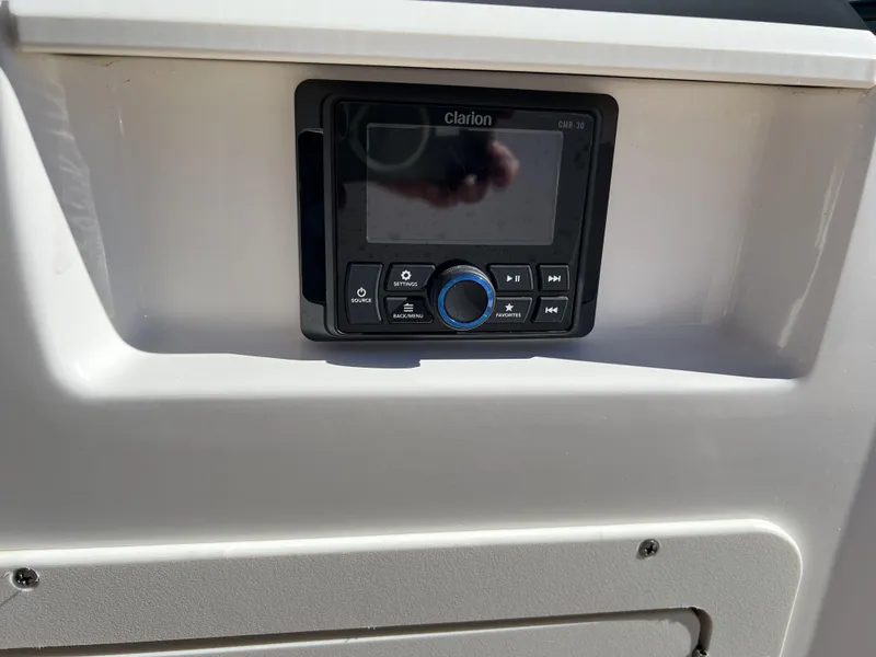 Slide: The Image of Clarion CMR-30 audio system on 2023 Chaparral 21SSi OB SPORT boat dashboard. - 13