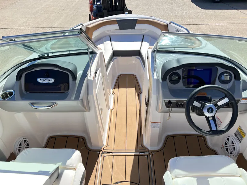 Slide: The Image of 2023 Chaparral 21SSi OB SPORT boat interior with modern dashboard and seating. - 3