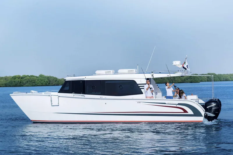 Slide: The Image of SilverCAT 40LUX 2026 luxury boat cruising on calm blue waters. - 1