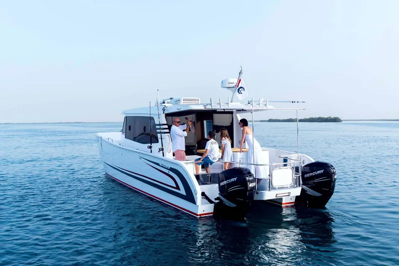 Slide: The Image of 2026 SilverCAT 40LUX boat on water with people enjoying leisure time. - 4