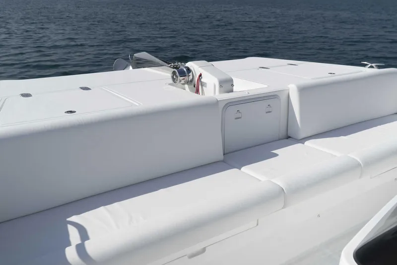 Slide: The Image of 2026 SilverCAT 40LUX boat deck with white seating, overlooking calm water. - 8