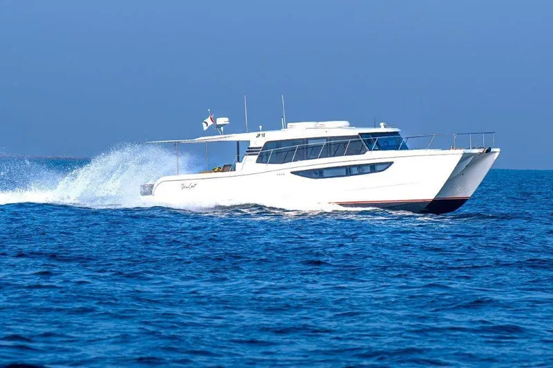 Slide: The Image of Luxury SilverCAT 46LUX yacht cruising on open sea, 2026 model. - 10