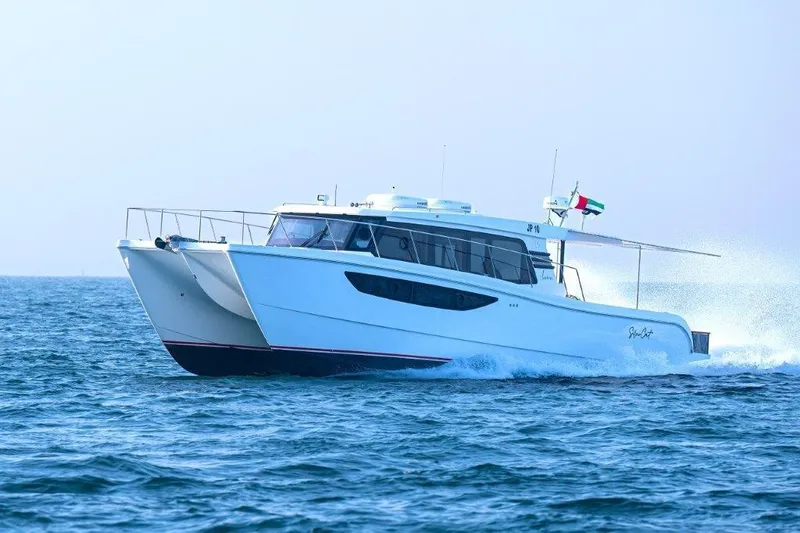 Slide: The Image of Luxury SilverCAT 46LUX catamaran cruising on open water, 2026 model. - 2