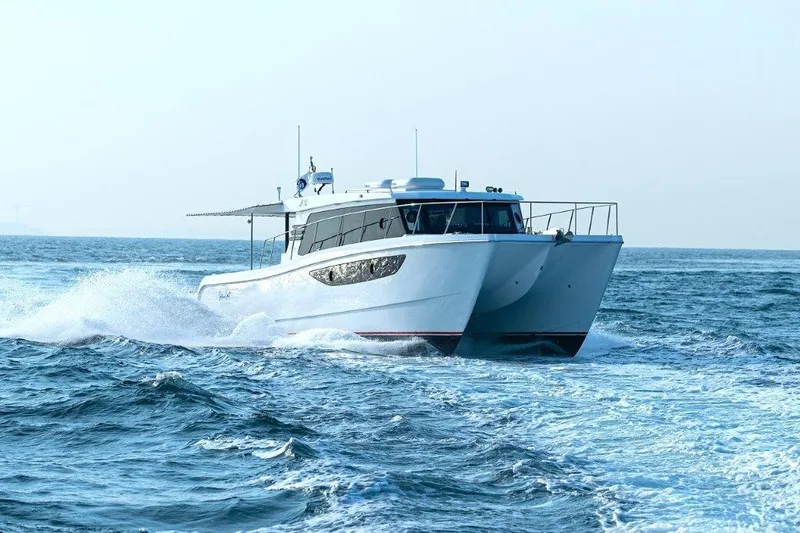 Slide: The Image of SilverCAT 46LUX 2026 catamaran cruising on open sea, creating waves. - 5