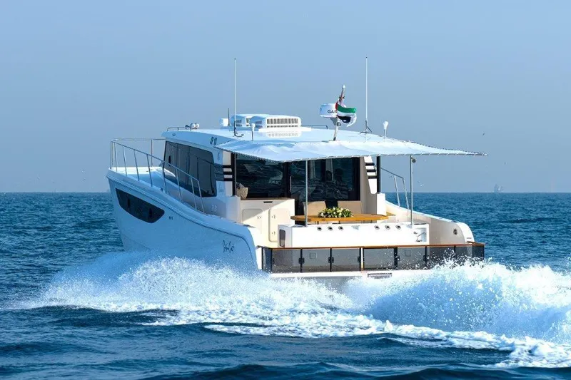 Slide: The Image of Luxury SilverCAT 46LUX yacht cruising on open sea, 2026 model. - 6