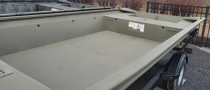 Slide: The Image of 2025 Tracker Grizzly 1860 Jon boat on trailer, ideal for fishing and hunting. - 3