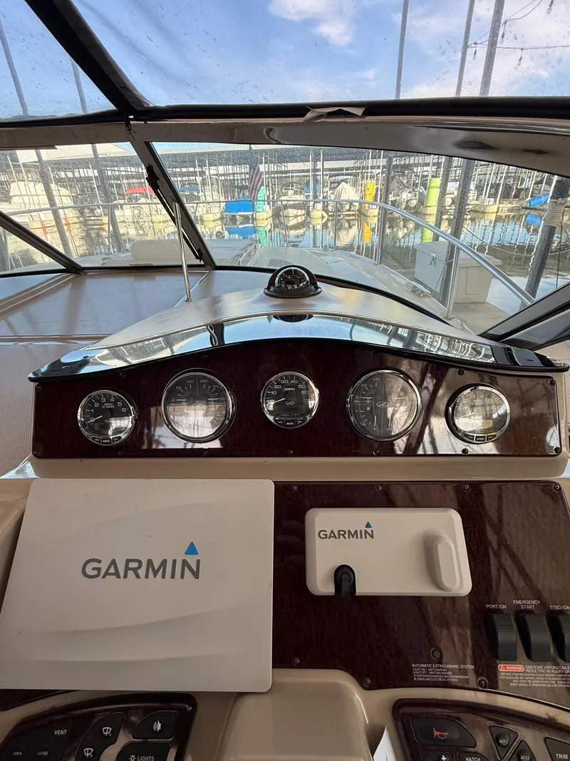 Slide: The Image of 2007 Sea Ray 310 Sundancer dashboard with Garmin navigation system. - 12