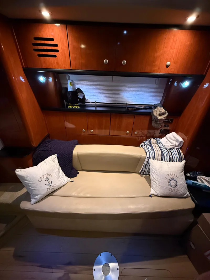 Slide: The Image of Interior of 2007 Sea Ray 310 Sundancer with cozy seating and elegant wood finish. - 20