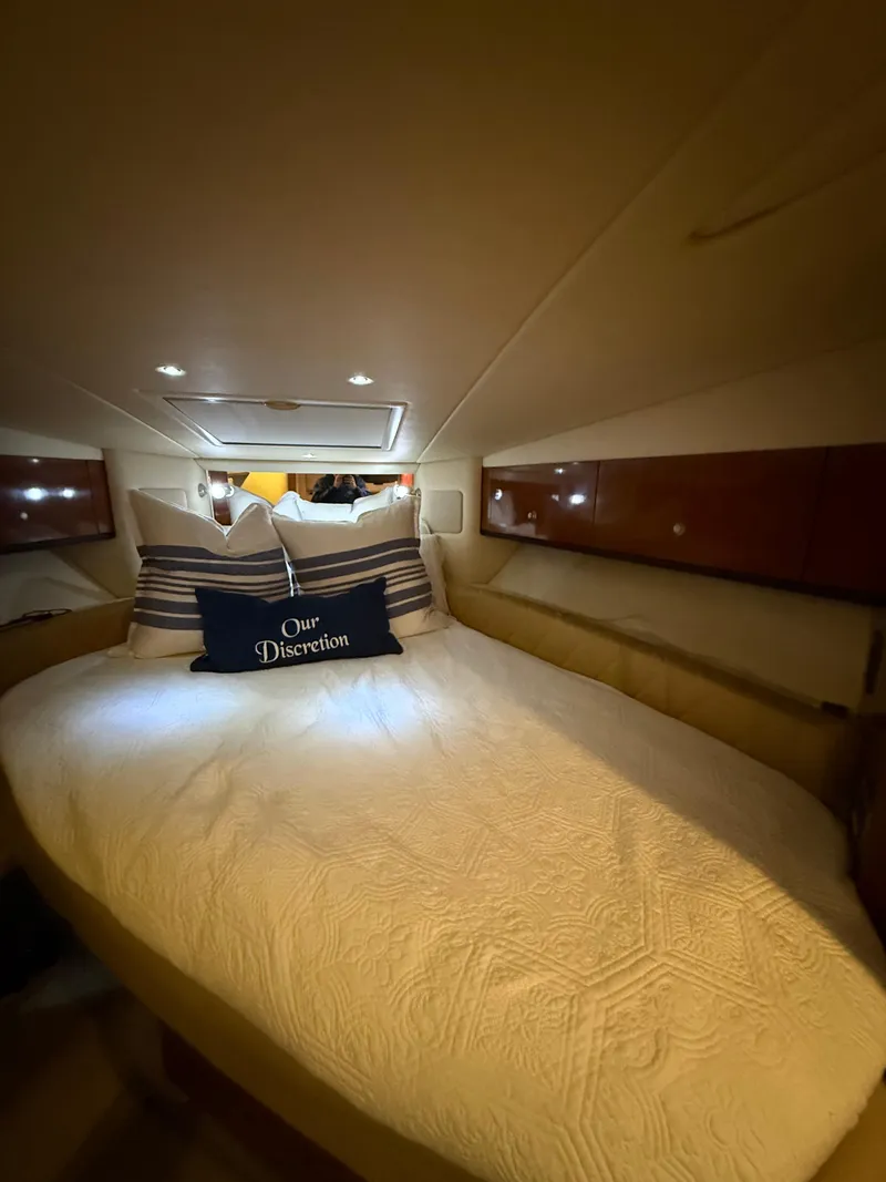 Slide: The Image of Luxurious cabin interior of 2007 Sea Ray 310 Sundancer yacht with cozy bedding. - 24