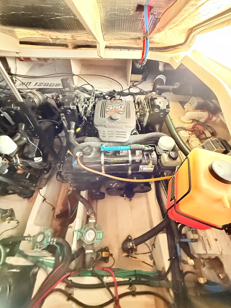 Slide: The Image of Engine compartment of a 2007 Sea Ray 310 Sundancer boat, showcasing mechanical components. - 30