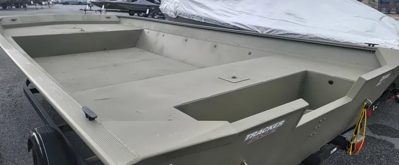 Slide: The Image of 2025 Tracker GRIZZLY 2072 Jon boat, spacious interior, parked outdoors. - 2