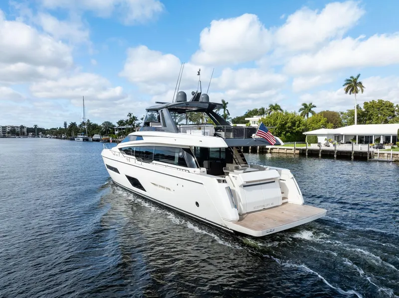 Slide: The Image of Ferretti Yachts 780, 2019 model, cruising on a scenic waterway with blue skies. - 13