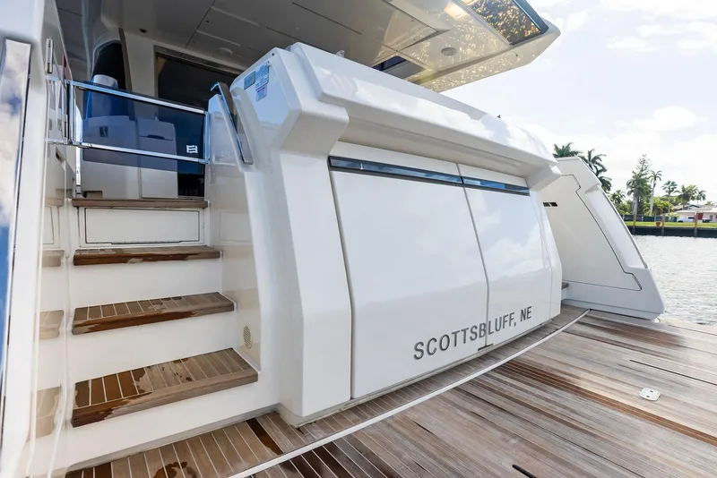 Slide: The Image of 2019 Ferretti Yachts 780, rear view with steps, docked near water. - 16