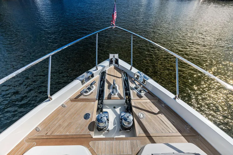 Slide: The Image of Bow view of 2019 Ferretti Yachts 780 on calm water, showcasing deck and railing. - 19
