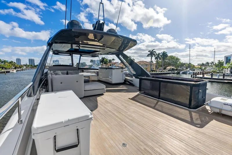 Slide: The Image of 2019 Ferretti Yachts 780, spacious deck, luxurious seating, sunny marina backdrop. - 24