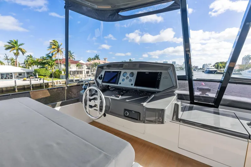 Slide: The Image of Helm of 2019 Ferretti Yachts 780 with modern controls and waterfront view. - 29