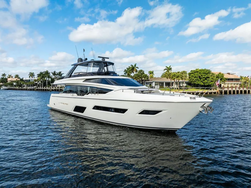 Slide: The Image of 2019 Ferretti Yachts 780 cruising on a sunny day, surrounded by palm trees and waterfront homes. - 3