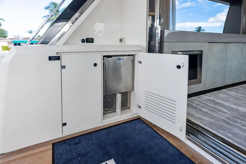 Slide: The Image of Interior of 2019 Ferretti Yachts 780, featuring open storage compartments and modern design. - 38
