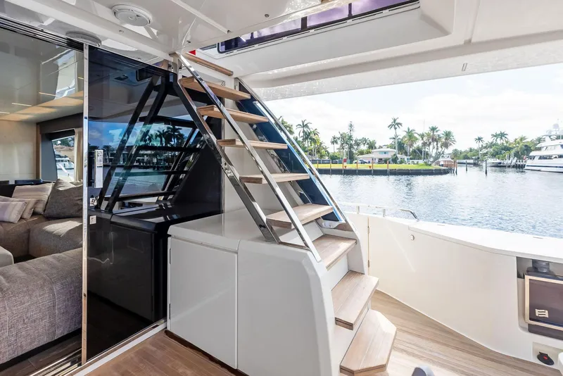 Slide: The Image of Luxurious 2019 Ferretti Yachts 780 interior with staircase and waterfront view. - 39
